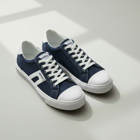 Novus Navy Canvas Sneakers on minimalist grey studio background
